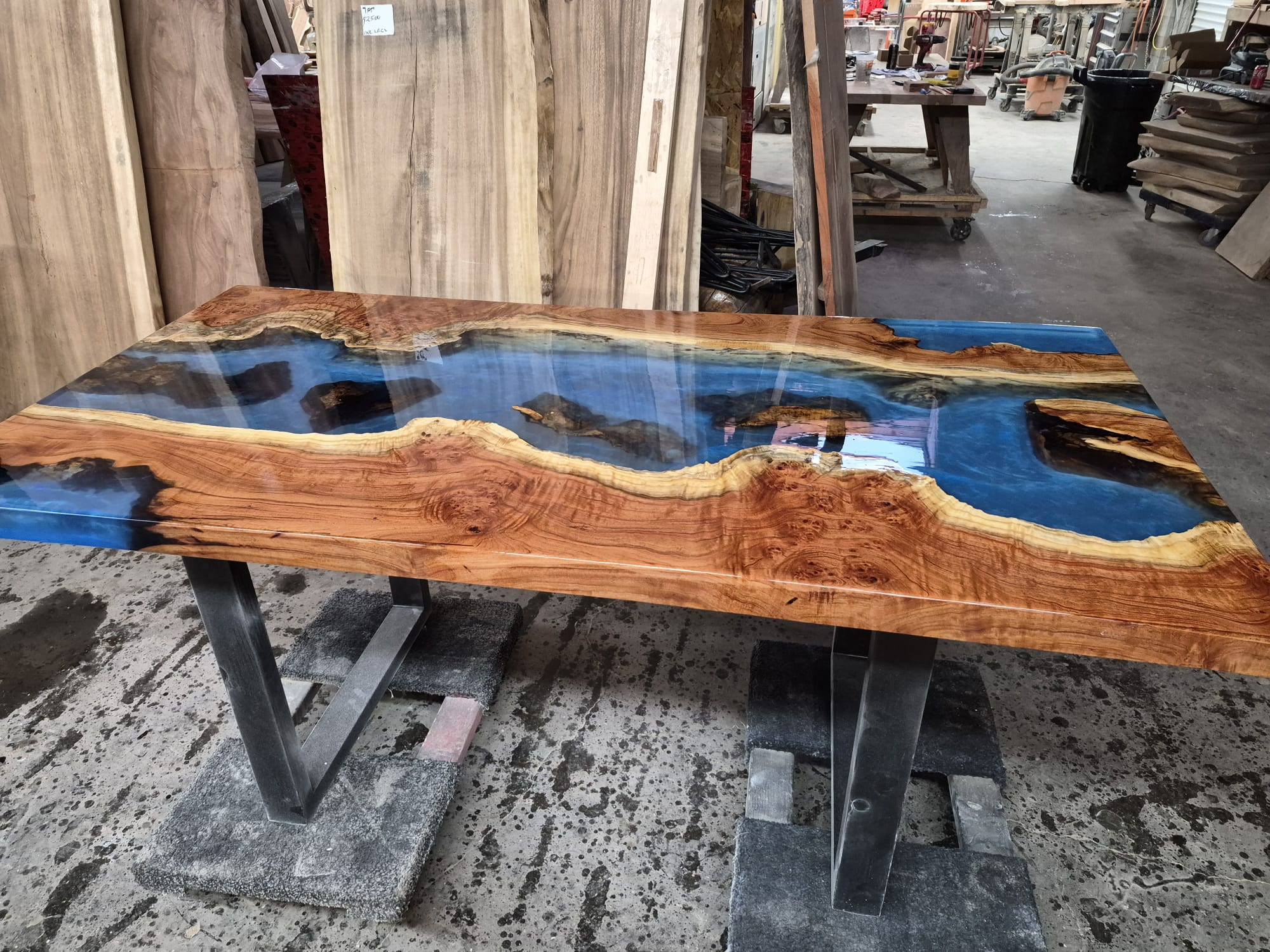 Blue epoxy table with burl wood and metal legs